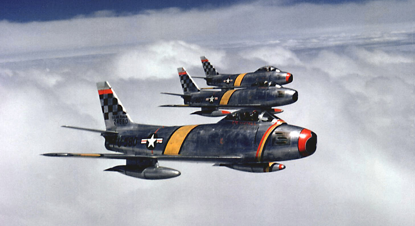 Insert image here: Close‑up of F‑86 wing root showing slat tracks and gun access panels.