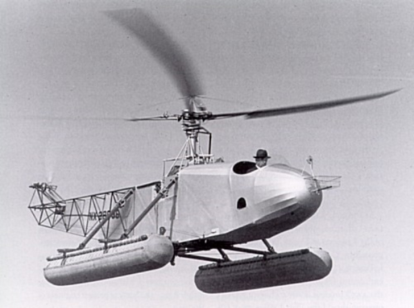 Insert image here: VS‑300 maintenance scene — cowlings open, gearbox inspection with drip trays and tools laid out.