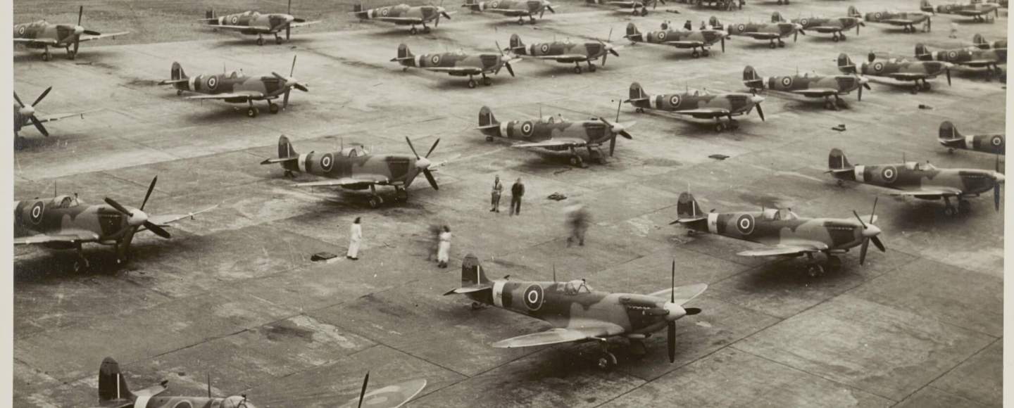 Insert image here: Close view of a Spitfire Merlin installation; cowl lines tight, exhaust stubs prominent.